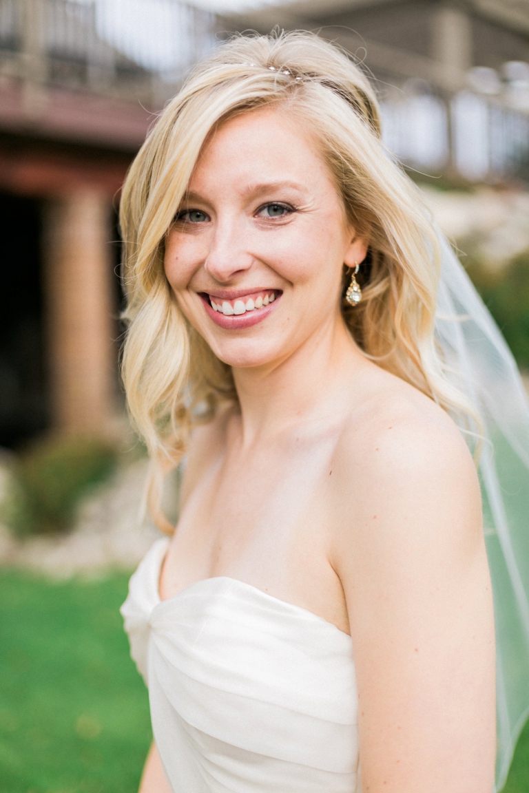 A portrait of a bride smiling at the Birchwood Farms Country Club in Harbor Springs 