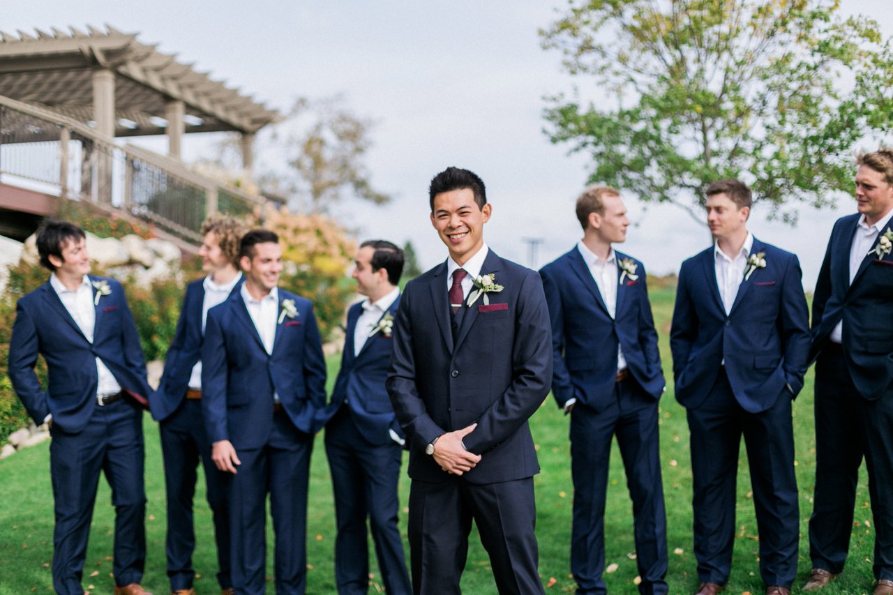 A groom and his groomsmen wearing Navy Snapsuits