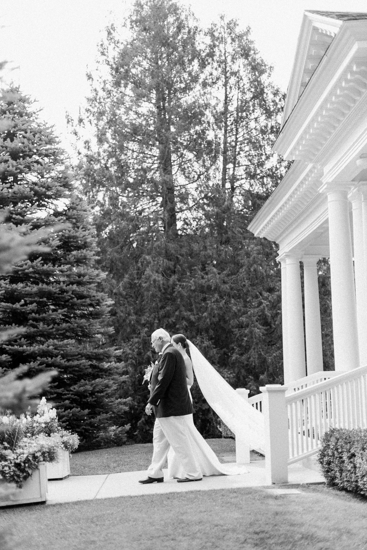 Father walking his daughter down the aisle at her wedding