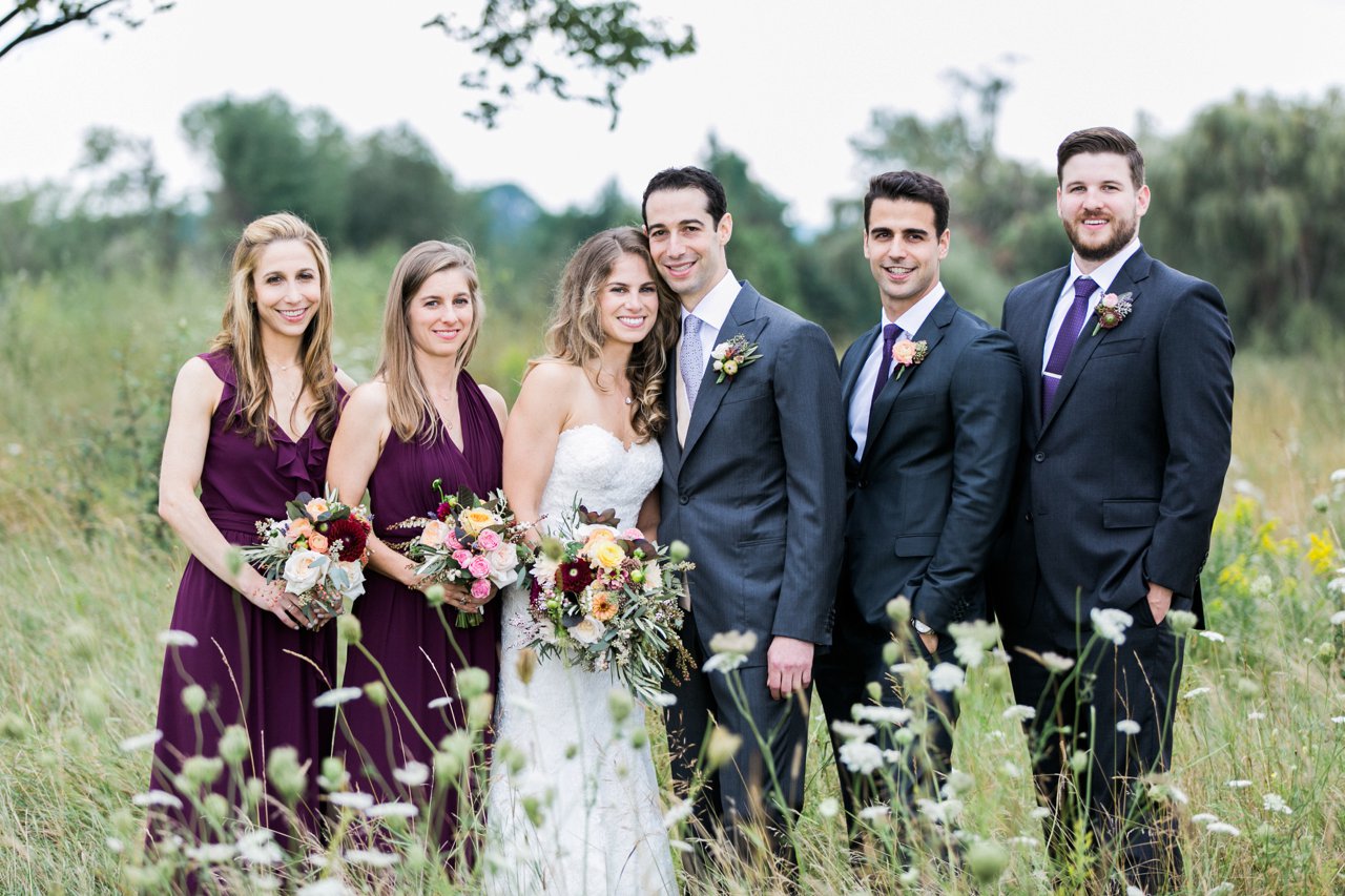 This is a photo of a bride and groom with their wedding party in Traverse City, Michigan.
