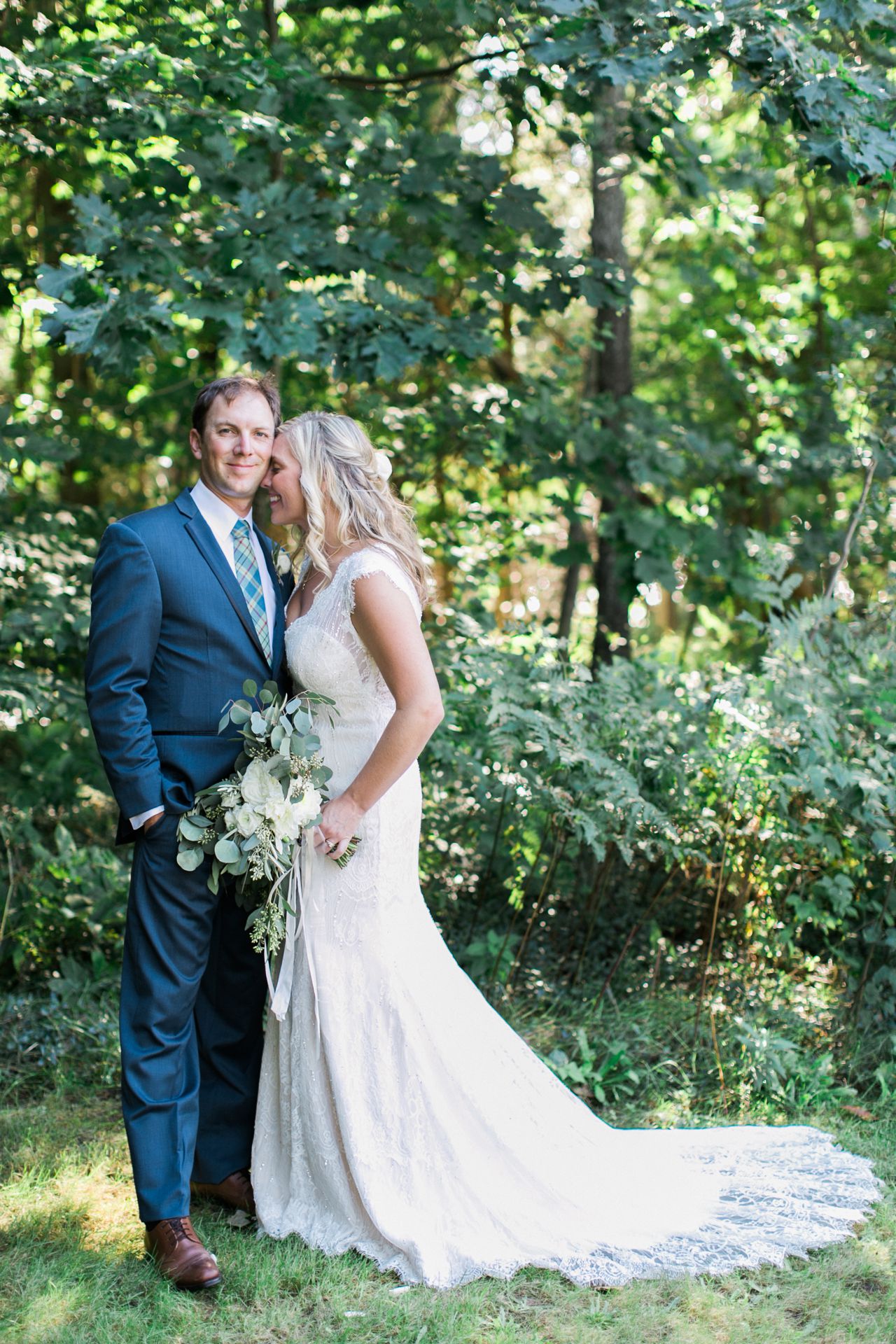 This is a bride and groom in the woods at Fountain Point Resort 