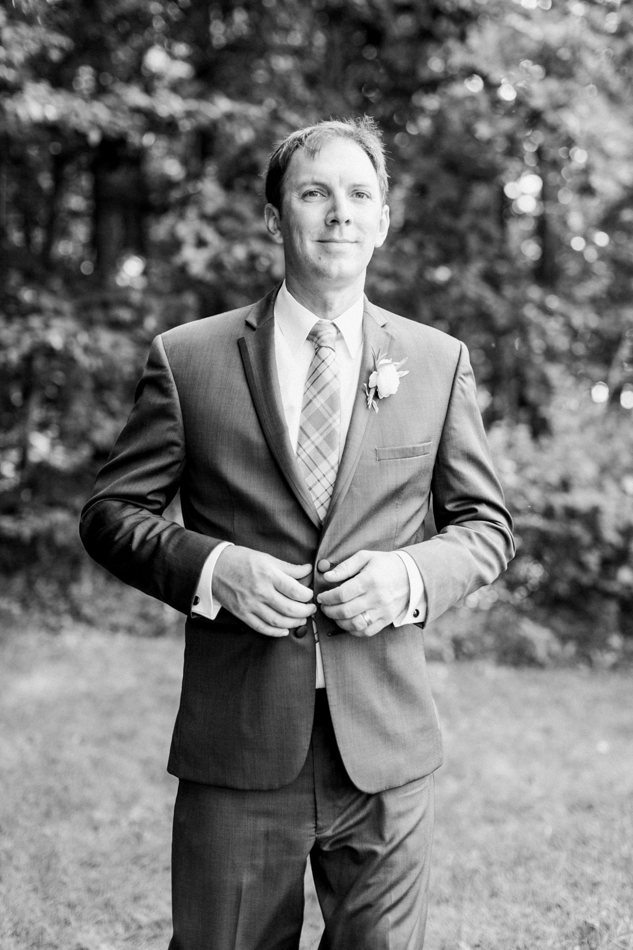 This is a portrait of a groom in the woods at Fountain Point Resort 