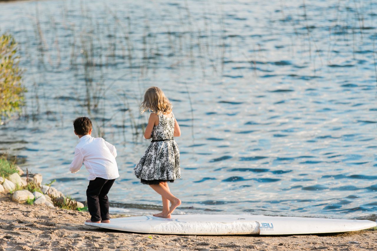 This is two children playing by the water on Lake Leelanau