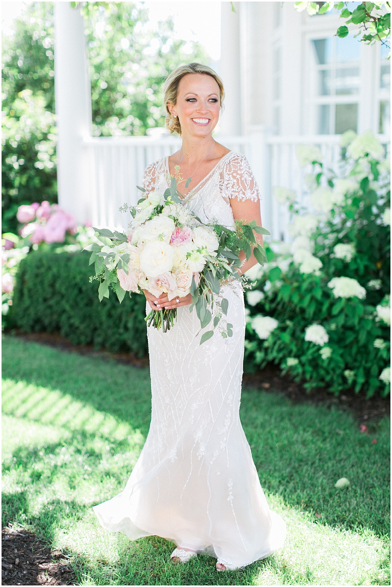 Portrait of a bride on a sunny day smiling in Bay Harbor, Michigan