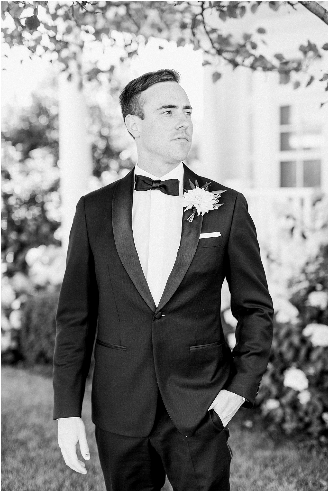 Portrait of a groom looking into the distance in Bay Harbor, Michigan