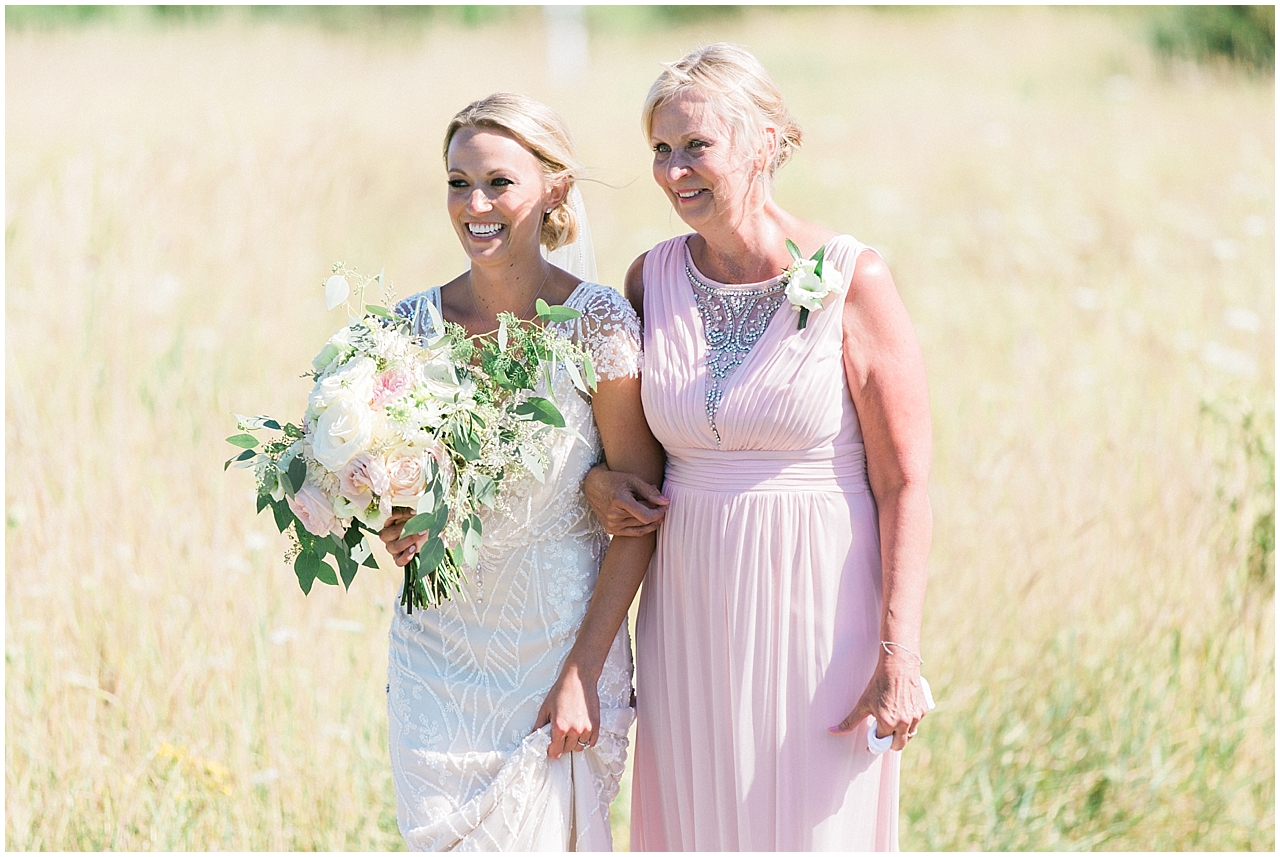 The bride walking to the ceremony at Shanahan's Barn in Charlevoix, Michigan