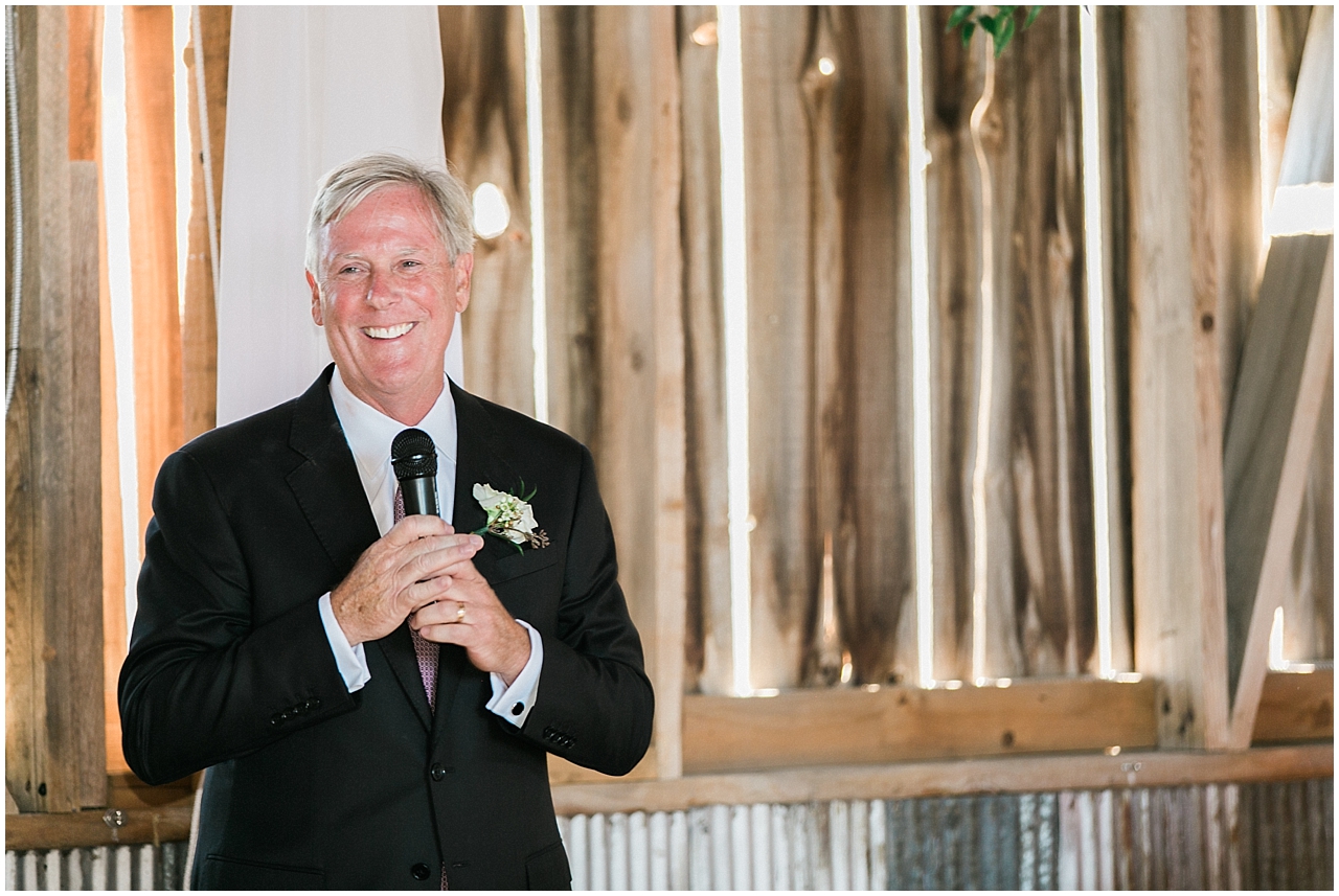 Father of the bride giving a speech and toast during the reception at Shanahan's barn in Charlevoix, Michigan