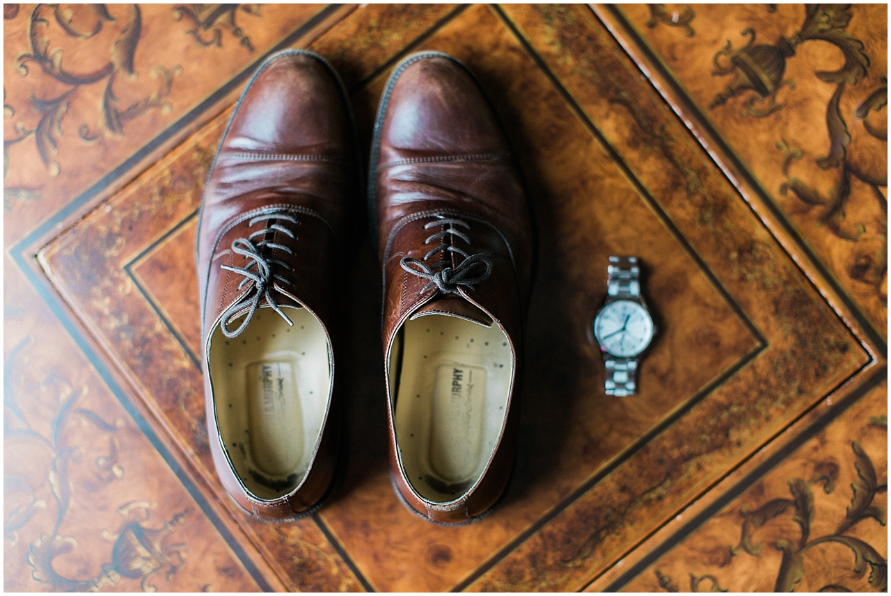 A groom's shoes and watch at the Stafford's Perry Hotel