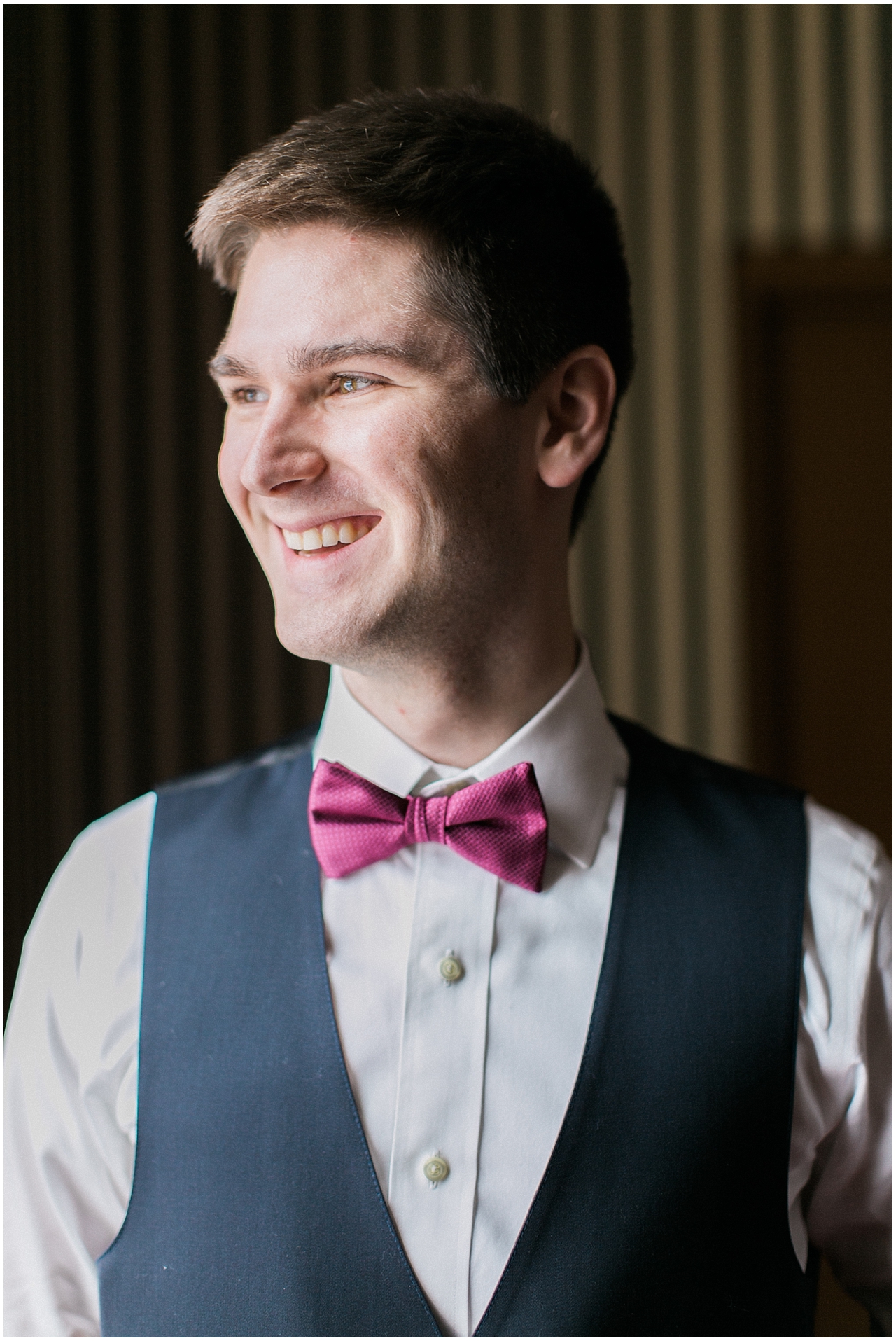 A groom portrait in the library at Stafford's Perry Hotel