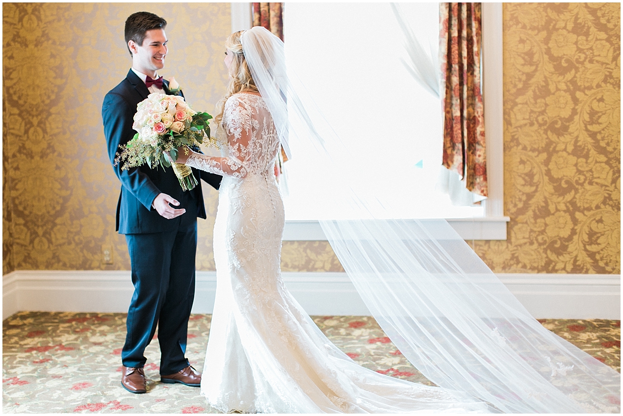 A bride and groom's first look at the Stafford's Perry Hotel