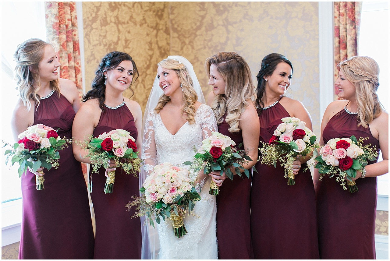 A bride and her bridesmaids who are wearing Burgundy dresses in Petoskey, Michigan