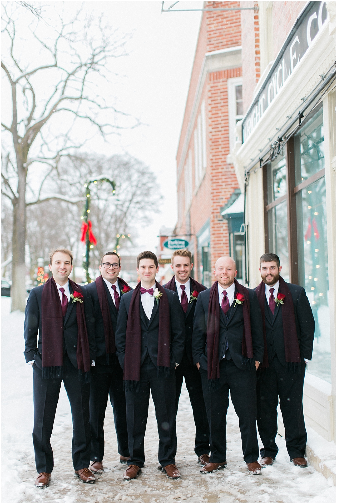 A groom and his groomsmen who are wearing burgundy ties and scarfs in Petoskey, Michigan