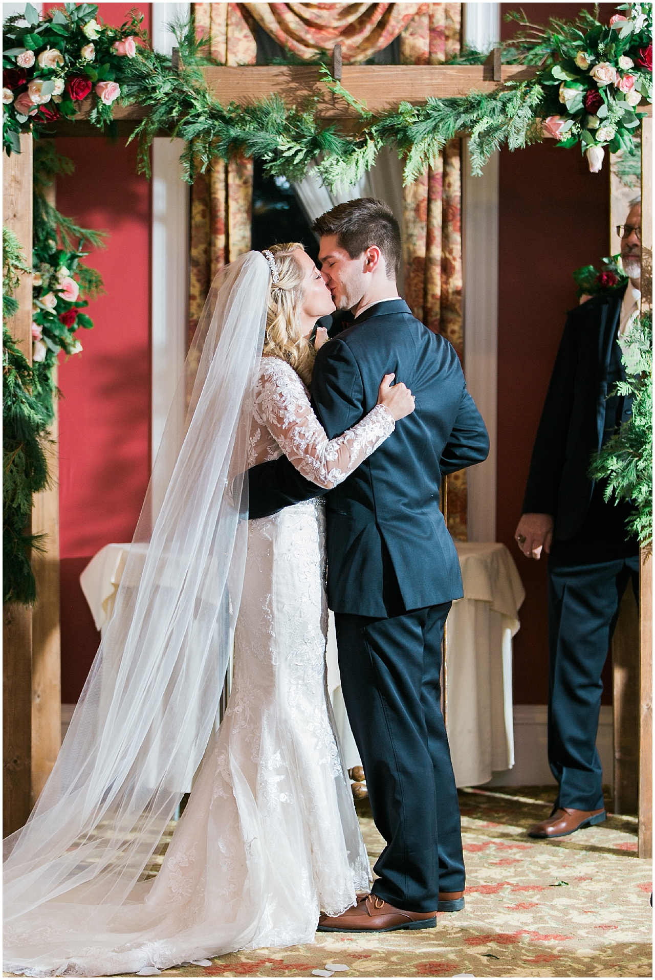 A bride and groom' first kiss at the Stafford's Perry Hotel