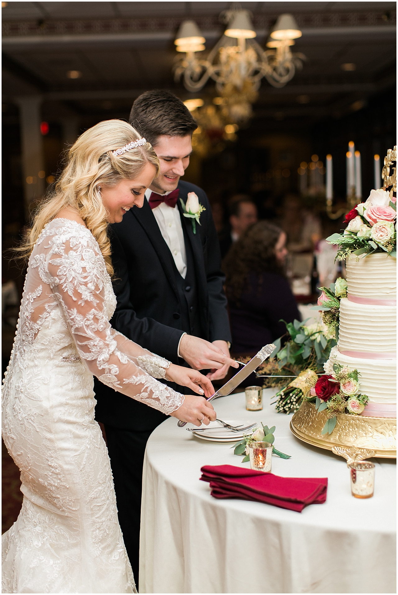 A bride and groom cutting their wedding cake at their wedding reception in Northern Michigan
