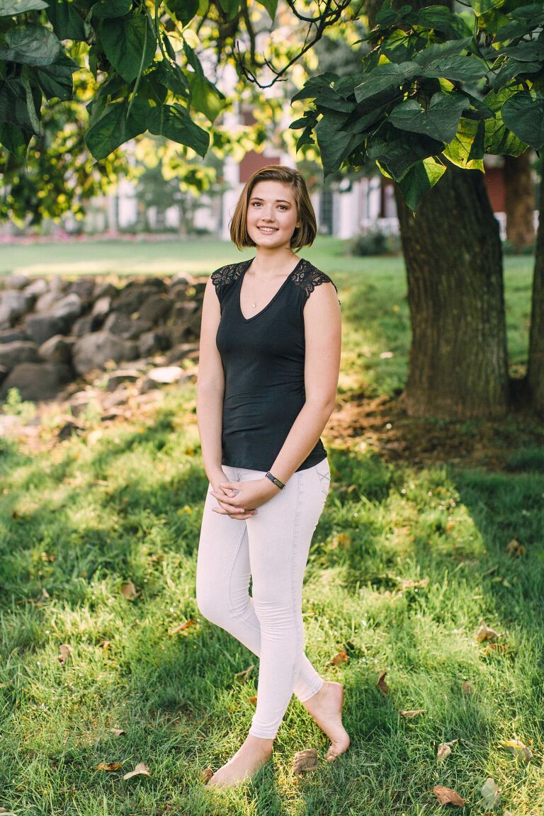 Northern Michigan Senior Portraits under a large tree at sunset