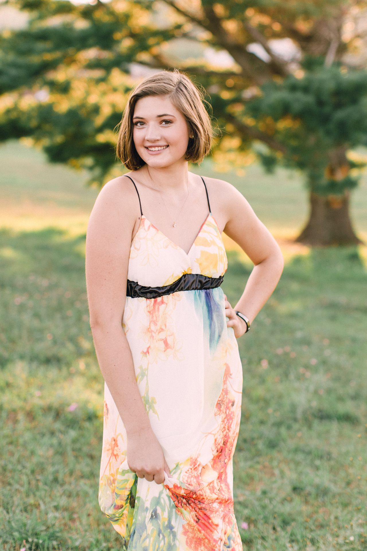 High school senior smiling during sunset in Northern Michigan