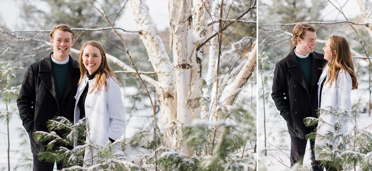 This is a couple taking engaged photos in the woods in Michigan