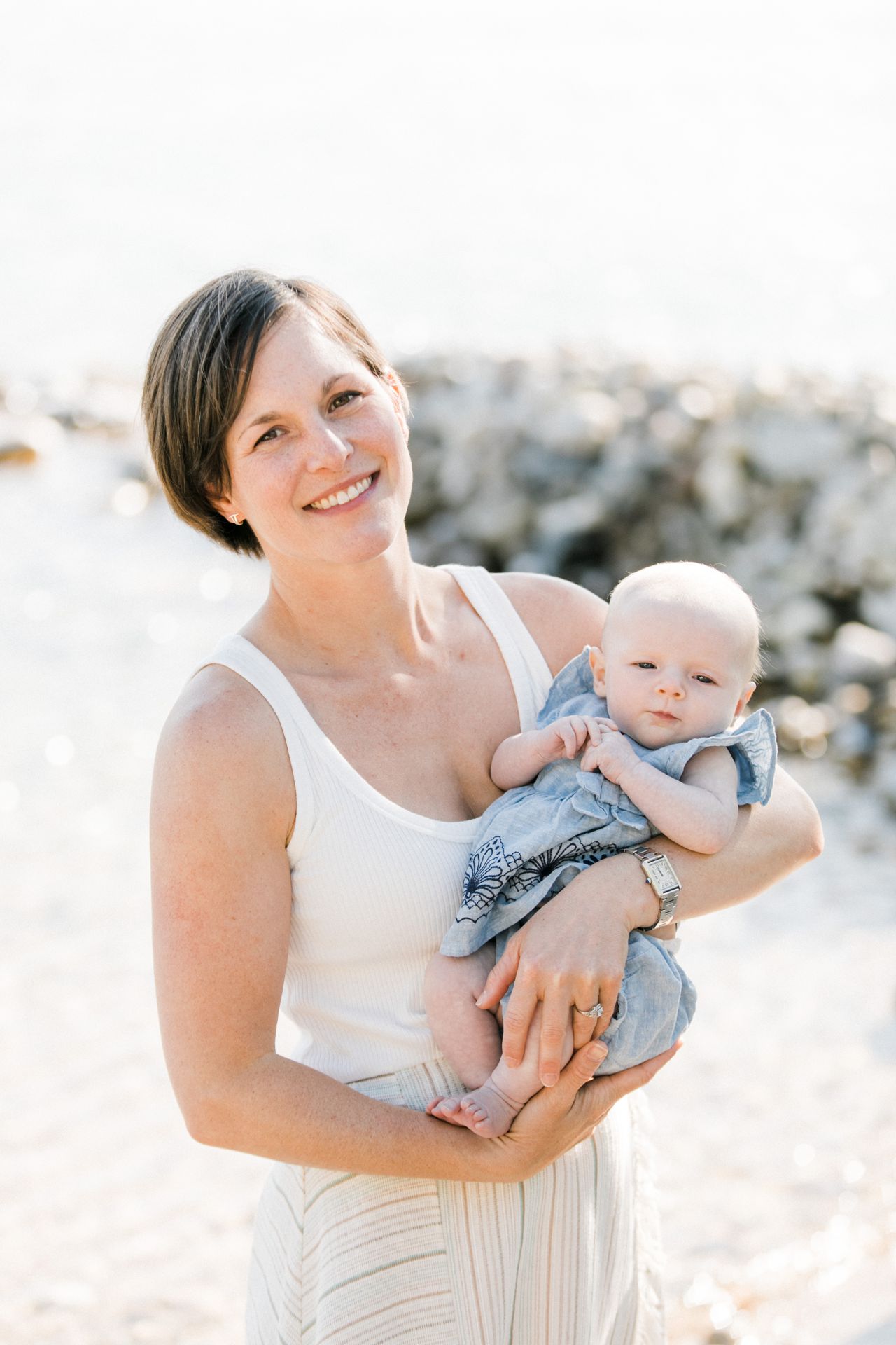 A portrait of a mother and baby daughter on Lake Michigan