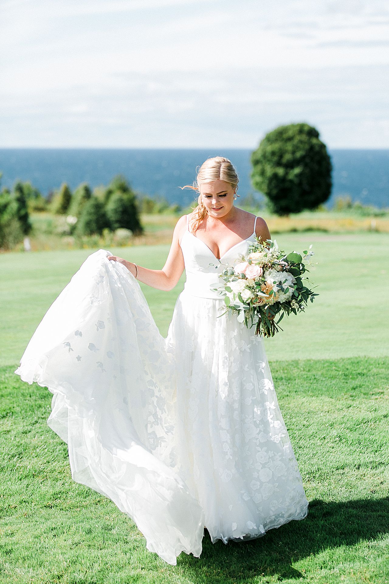 Bride holding up the train of her dress