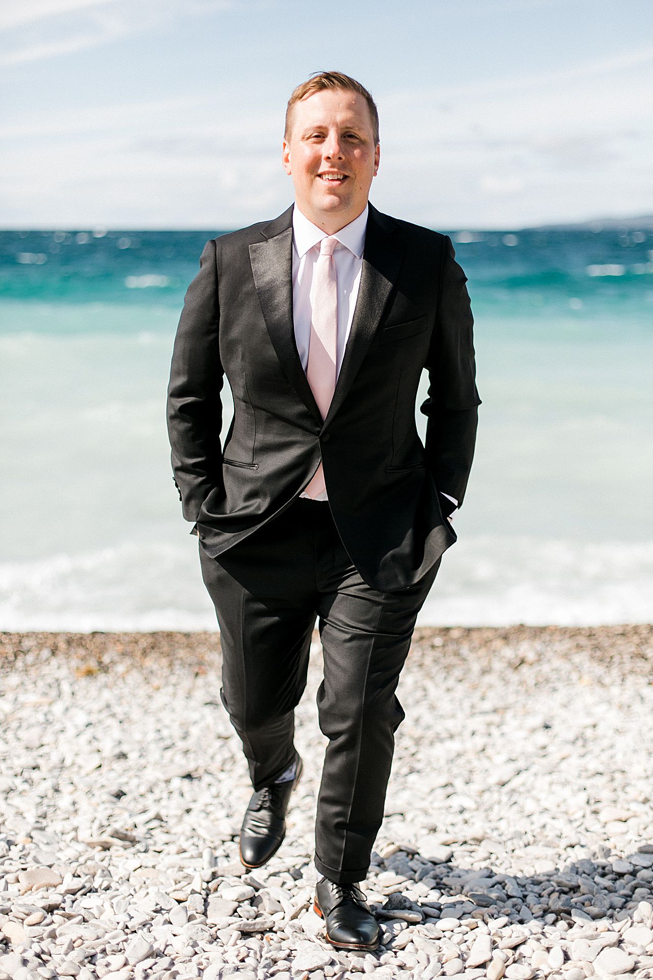Groom portrait on the beach in Bay Harbor