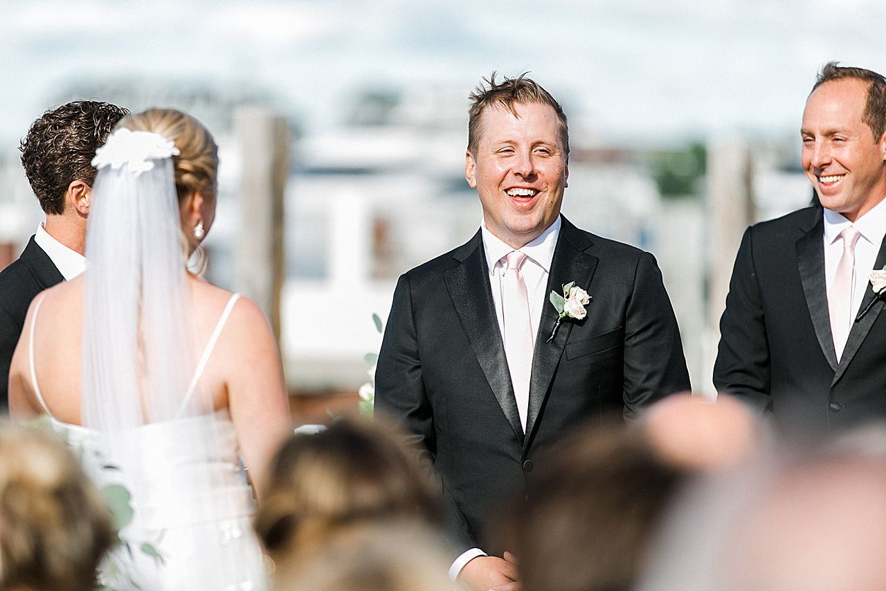 Groom smiling during the wedding ceremony