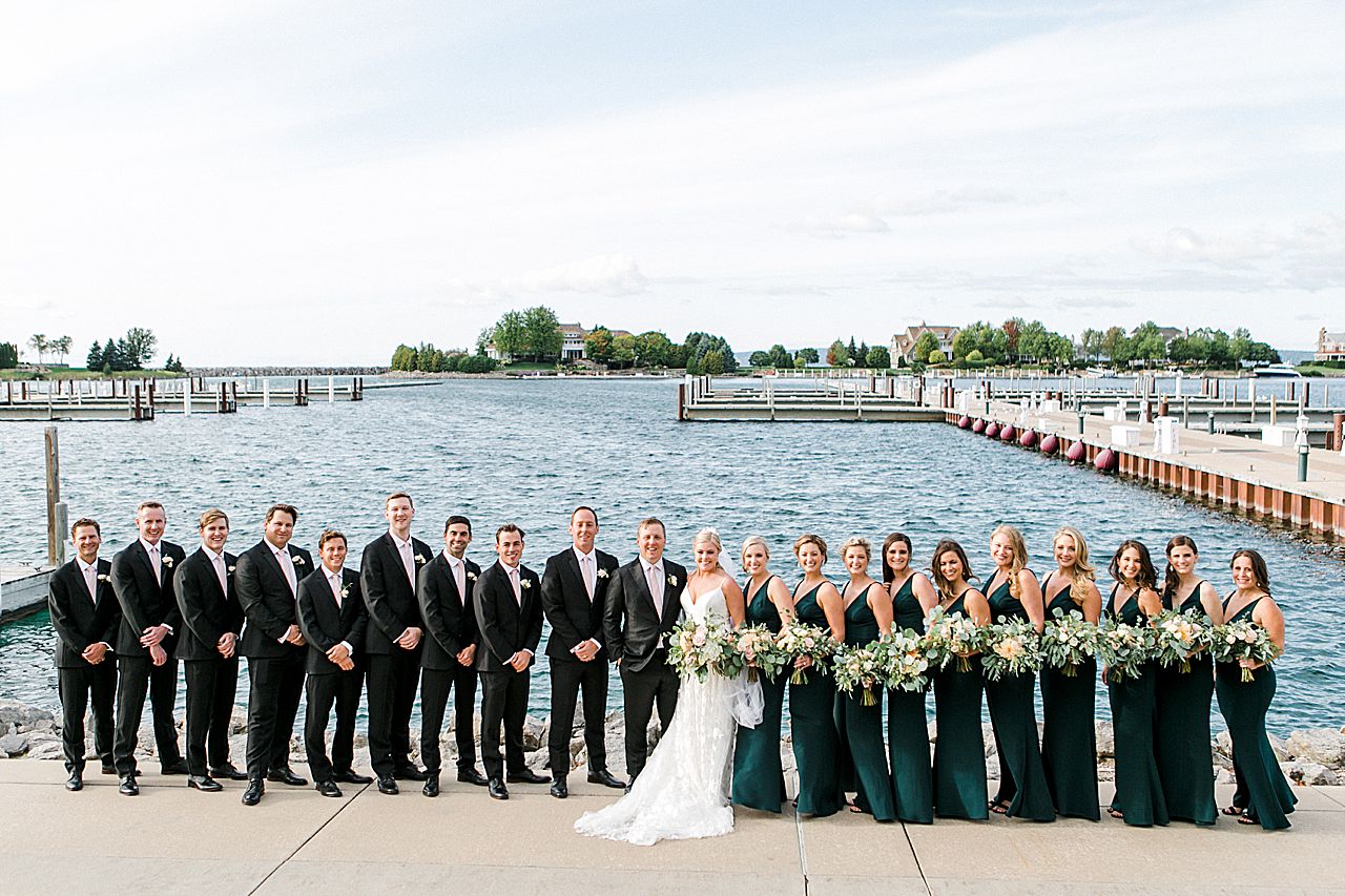 Bridal party portraits in front of the harbor in Michigan
