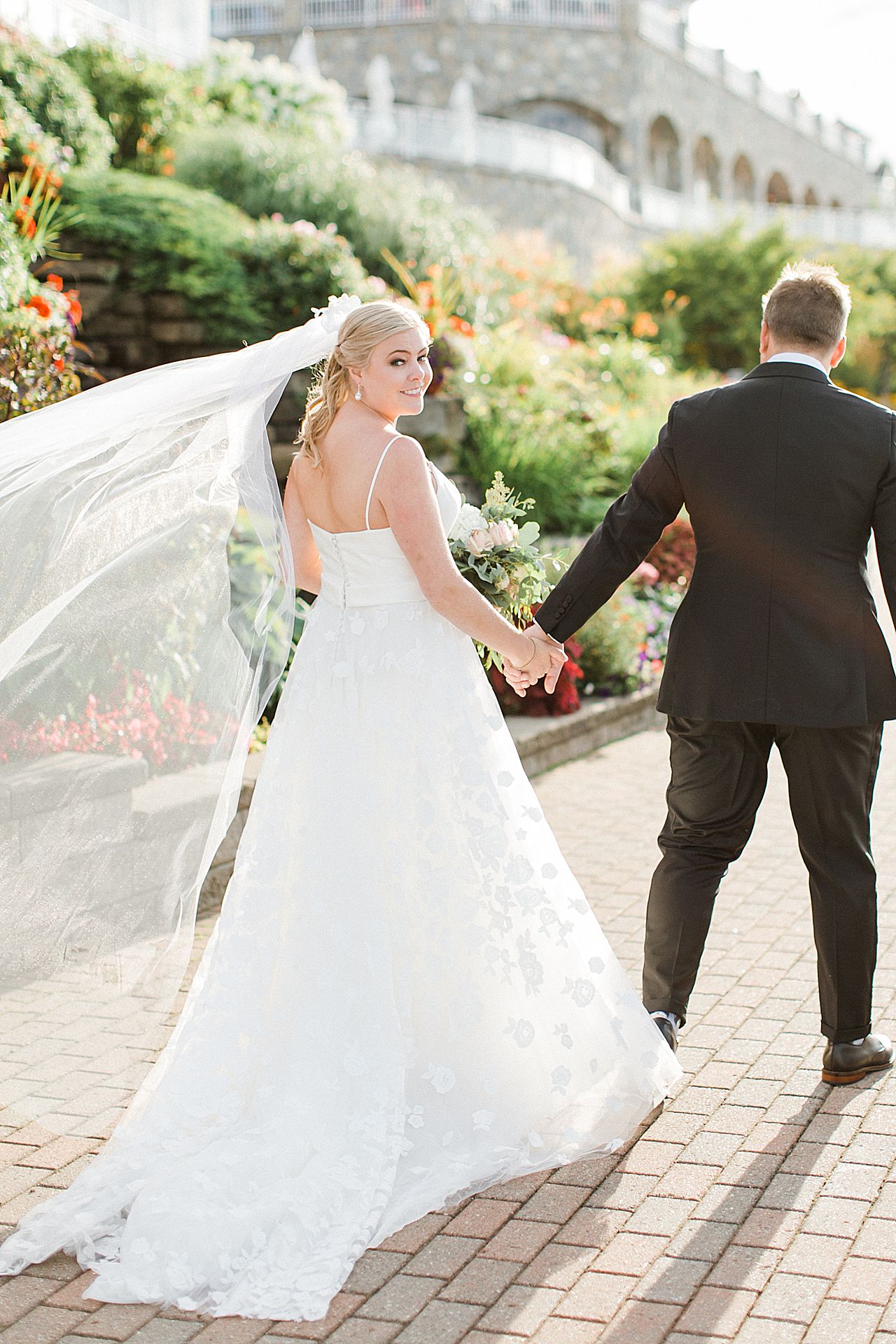 Bride and groom walking hand in hand