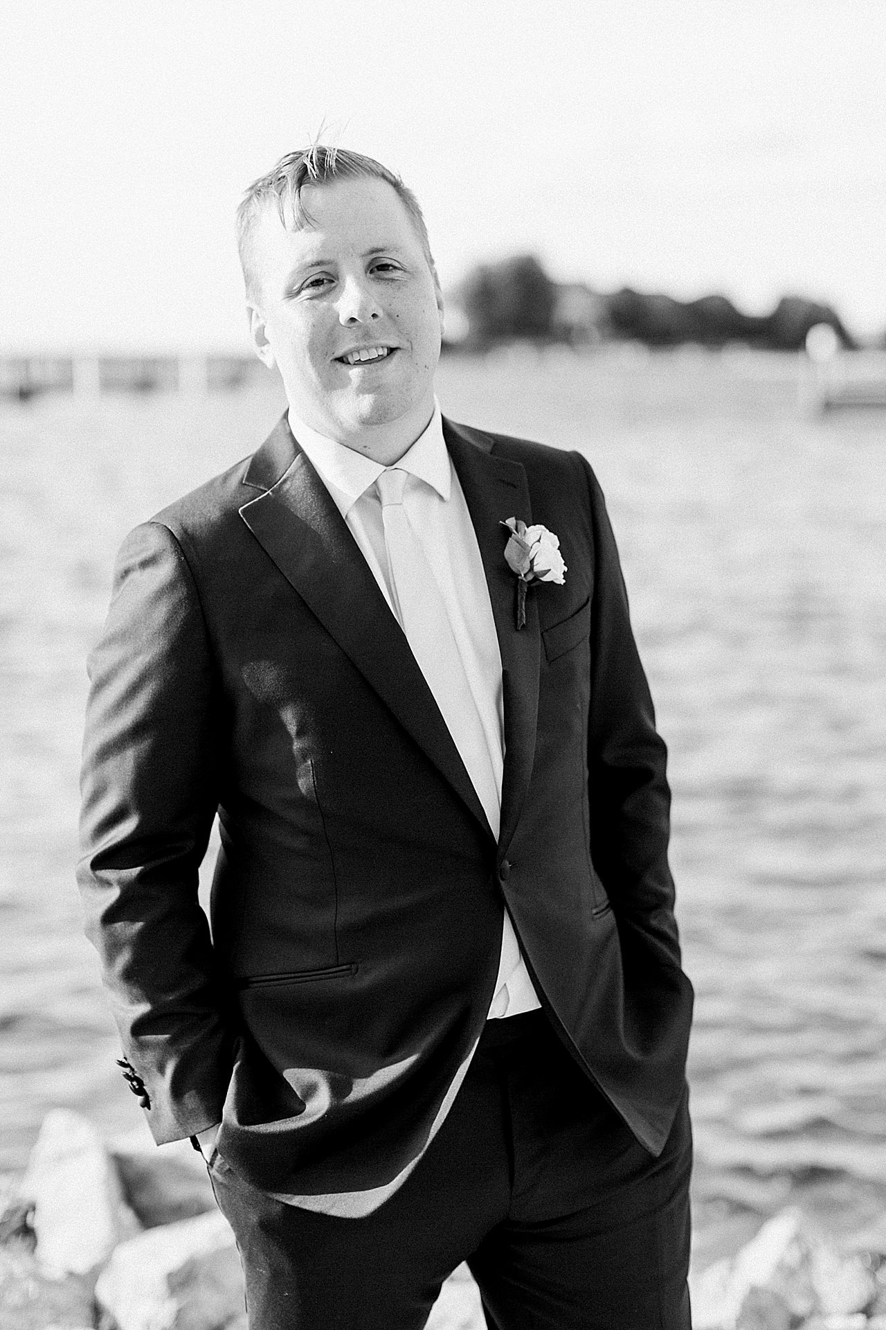 Black and white groom portrait in Petoskey, Michigan