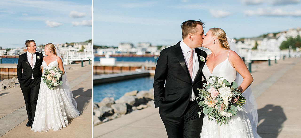 Bride and groom walking near the water in Bay Harbor, Michigan