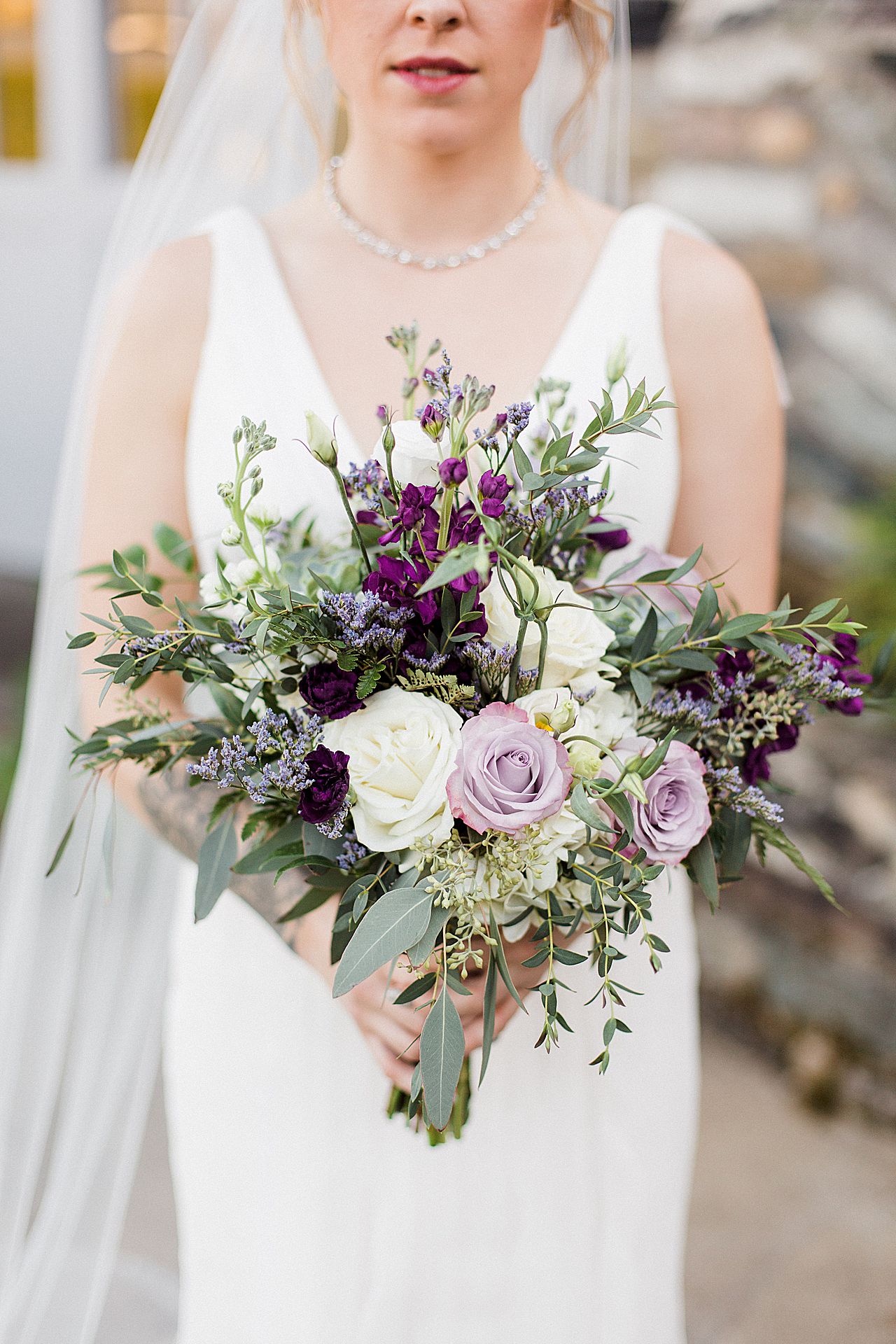 This is a photo of a bridal bouquet outside of the Knight's Castle in Charlevoix, Michigan