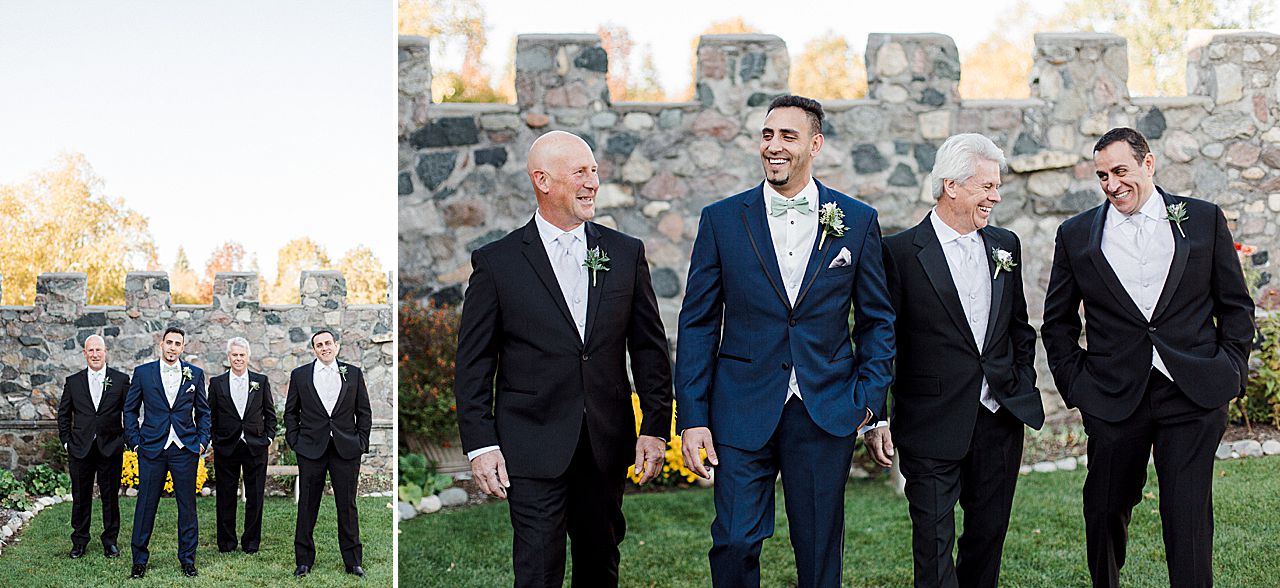 This is a photo of a groom in a blue suit and his groomsmen in black suits at Castle Farms