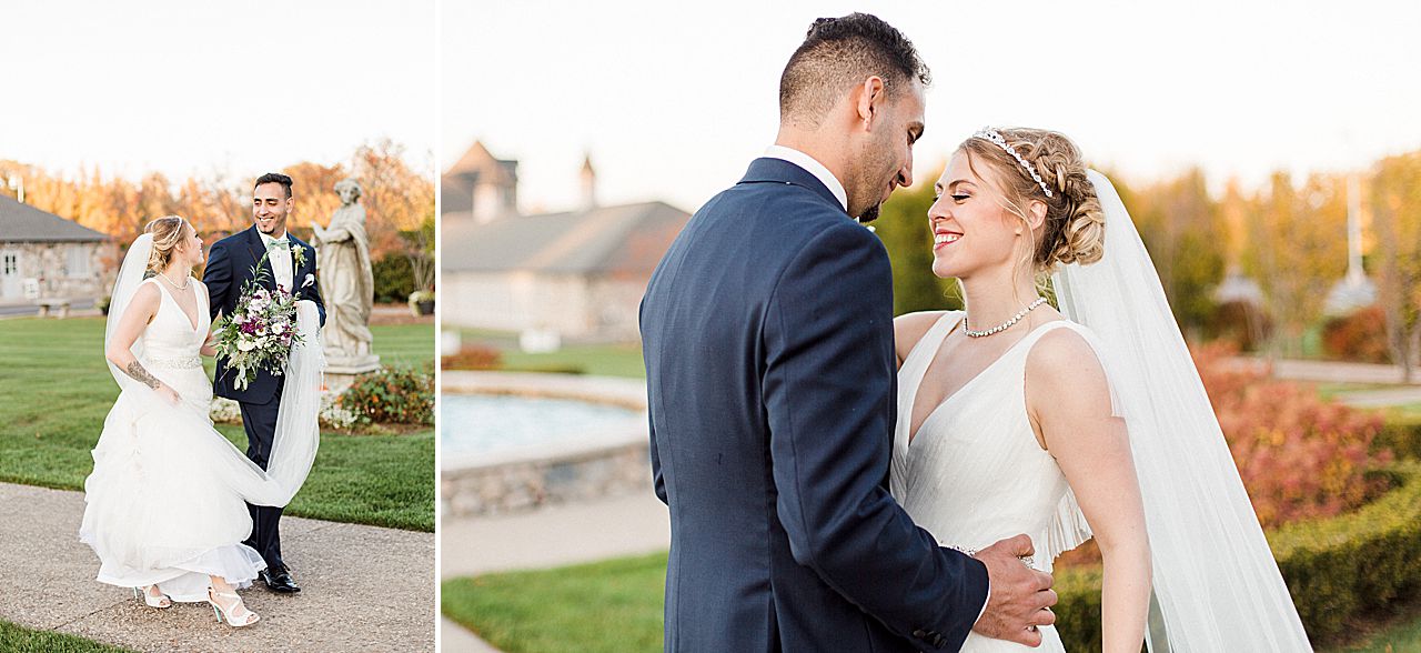 Bride and groom smiling while taking portraits in the Kings Grand Courtyard at Castle Farms in Charlevoix, Michigan with a fountain in the background