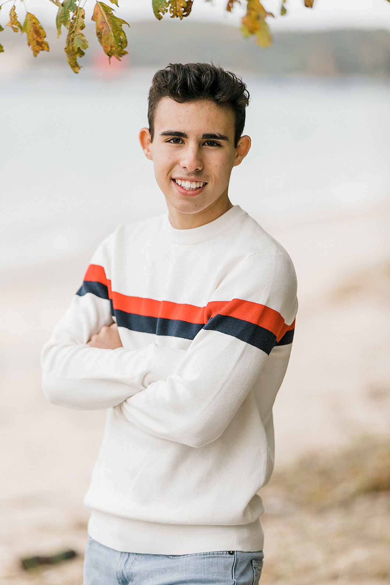 Senior smiling for photo in Charlevoix, Michigan