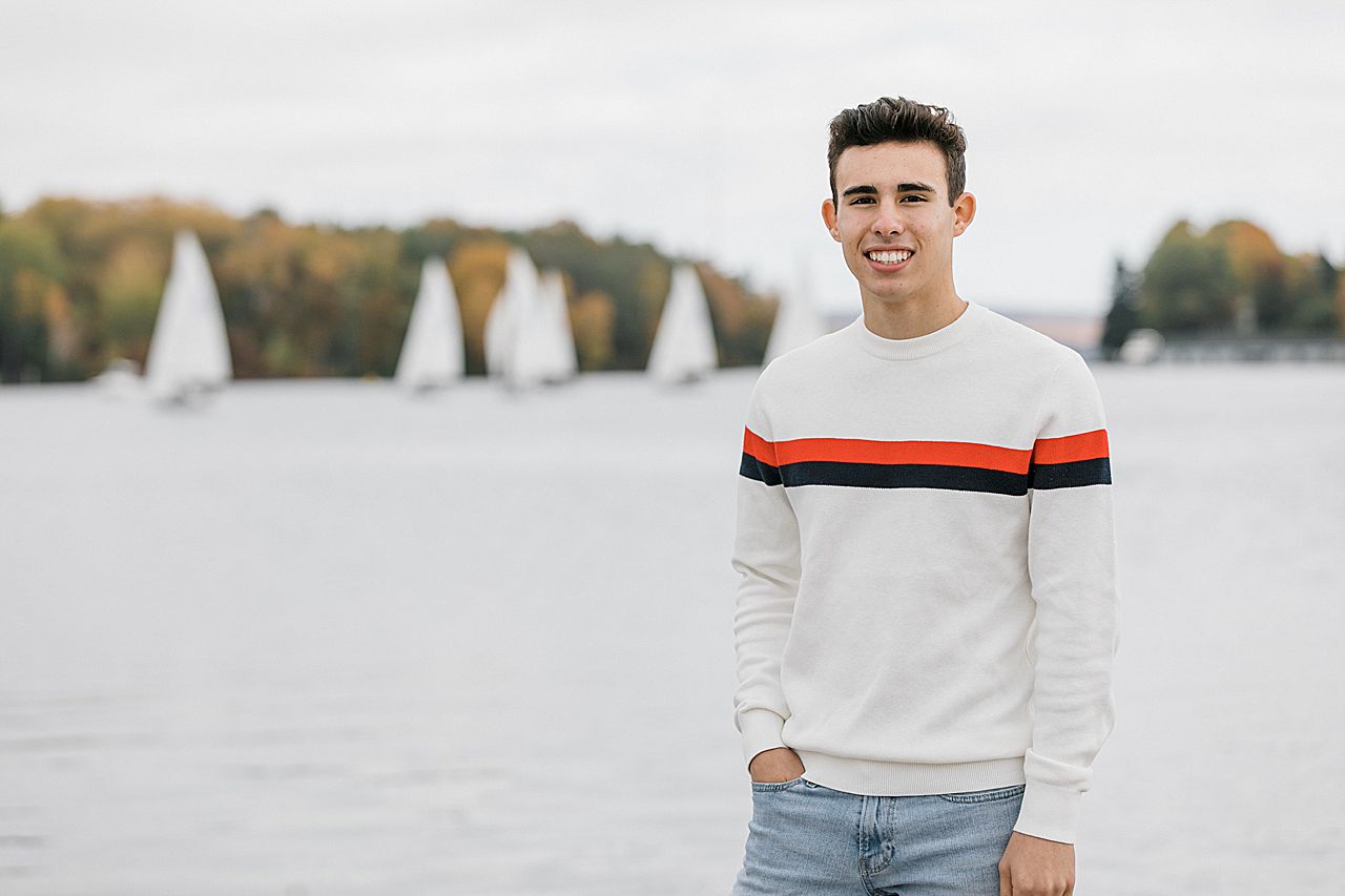 Senior portraits in front of a sailboat race