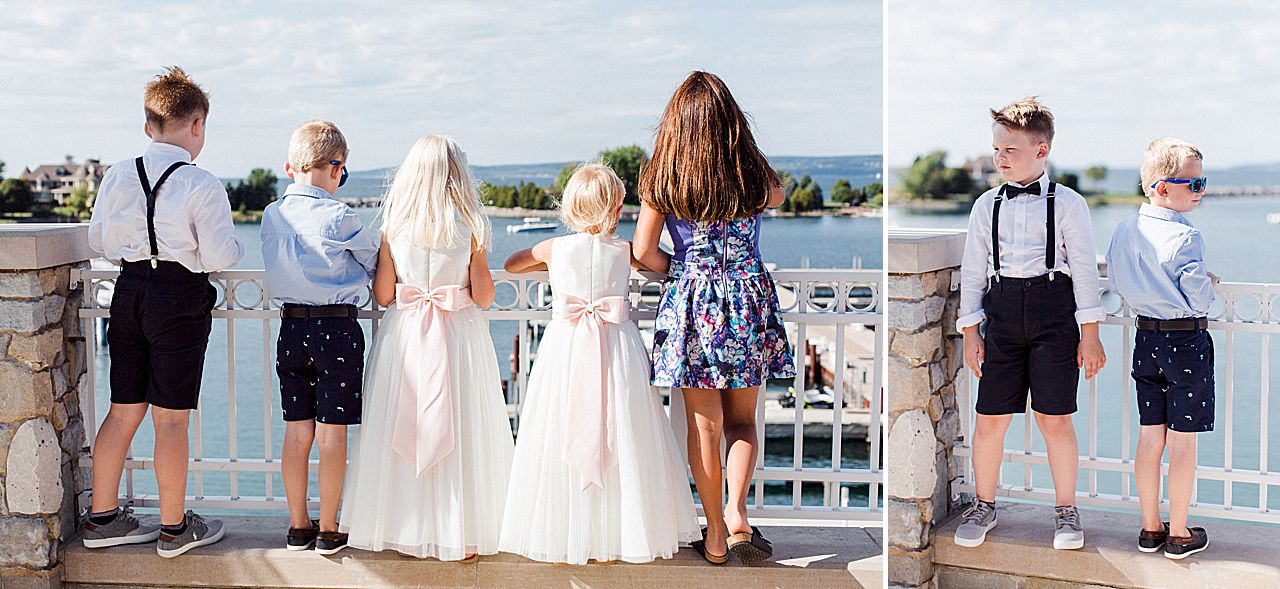 The flower girl and ring bearer's looking out at the water in Bay Harbor