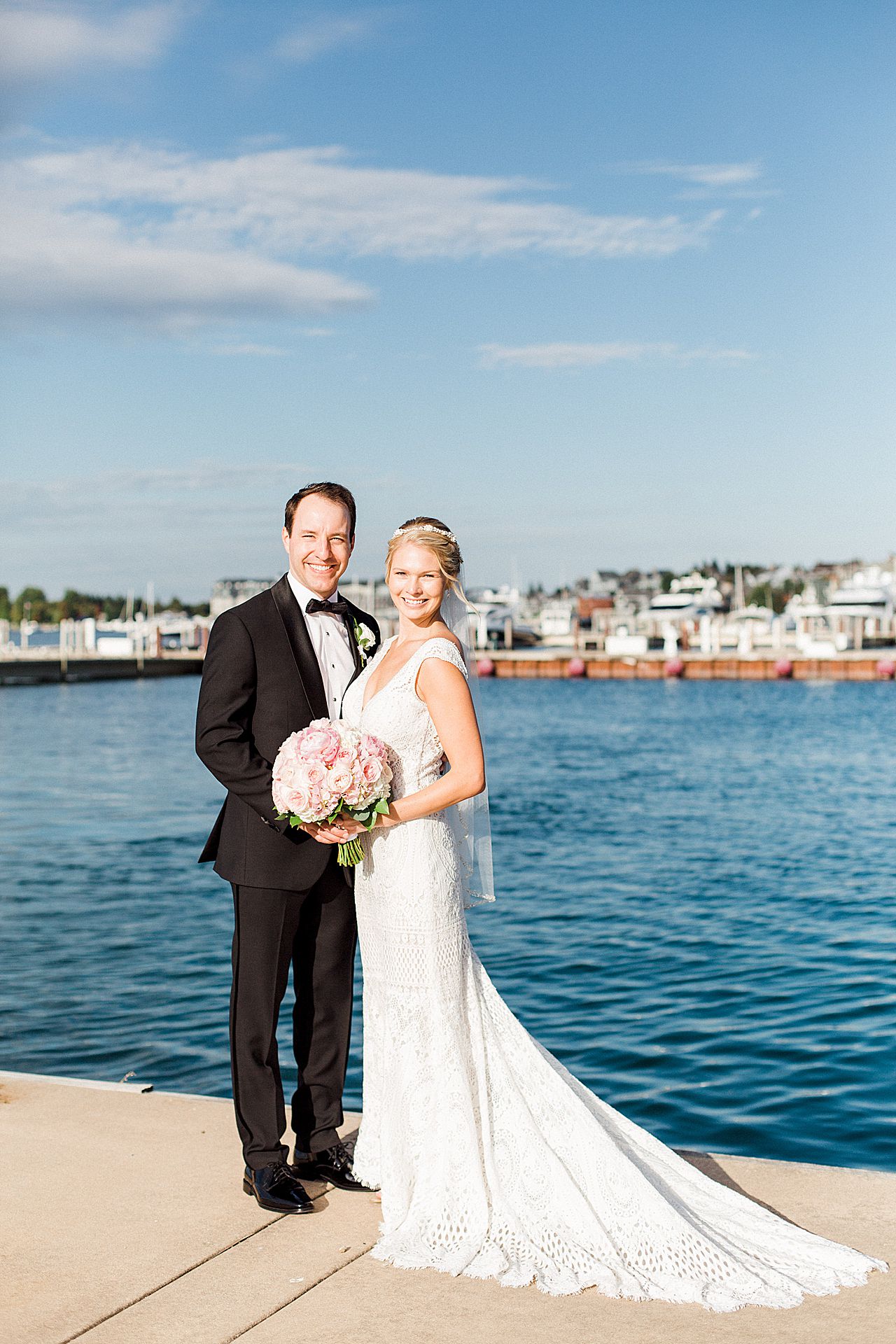 Newlywed couple by Lake Michigan in Bay Harbor