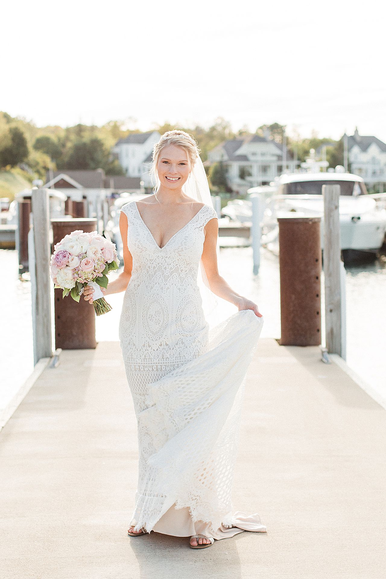Bride smiling in the sunshine at the Bay Harbor Marina 