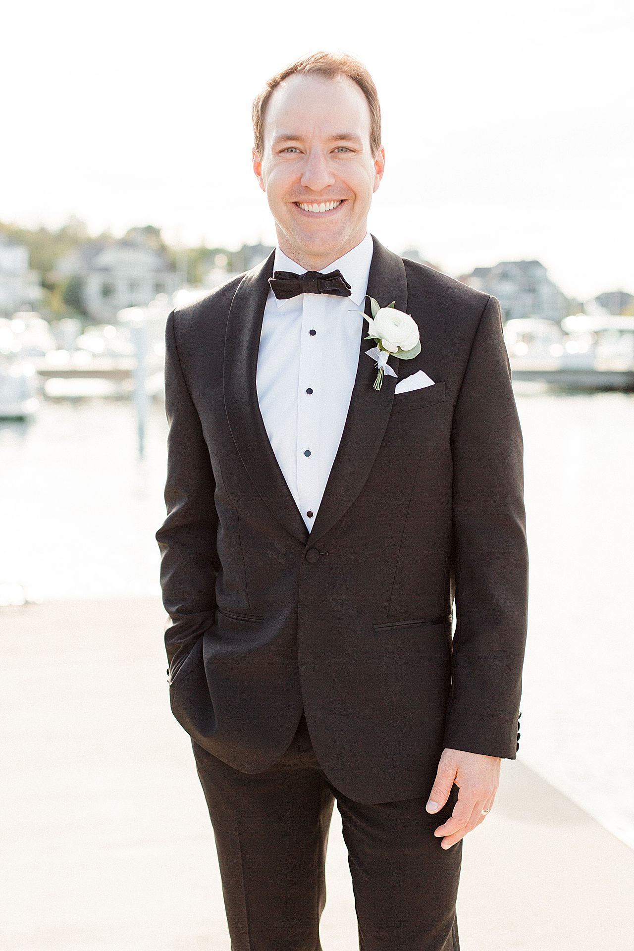 Portrait of a groom smiling in Northern Michigan 
