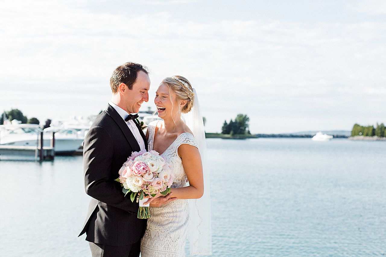 A bride laughing with her groom after their wedding ceremony