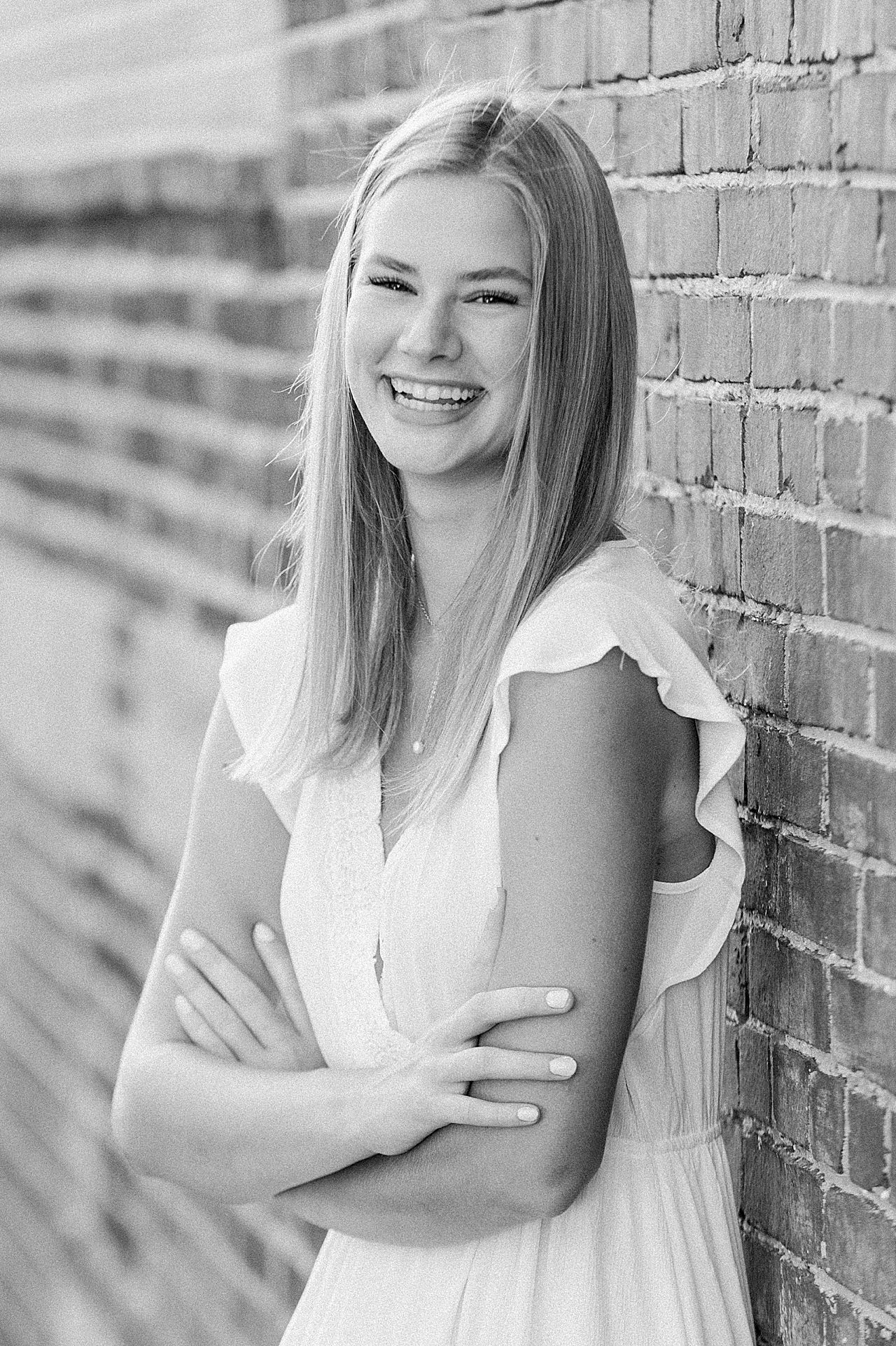 This is a photo of a high school senior laughing in a portrait