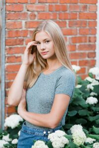 This is a portrait of a high school senior getting her portraits taken in downtown Boyne City, Michigan