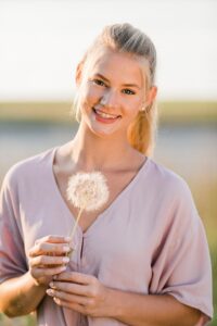 This is a photo of a senior portrait at sunset in Northern Michigan