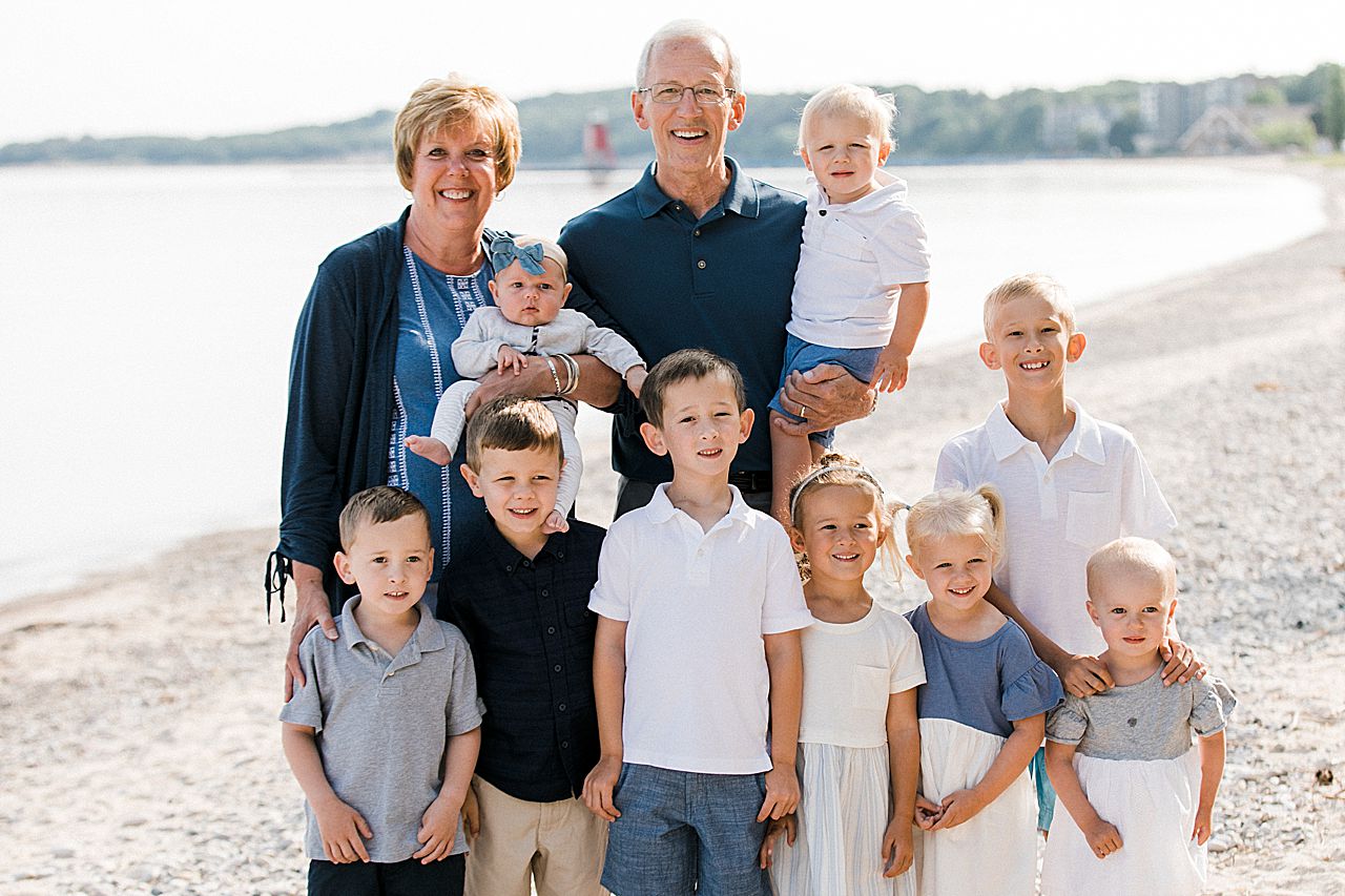Grandma and Grandpa with their grandkids on a beach in Charlevoix, Michigan