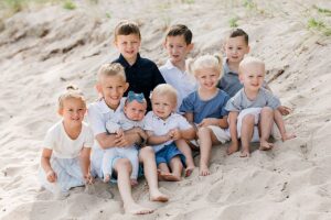 Cousins sitting on a beach in Northern Michigan