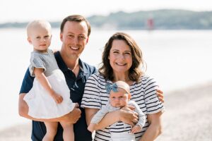 Mother and father with their two young daughters in Northern Michigan