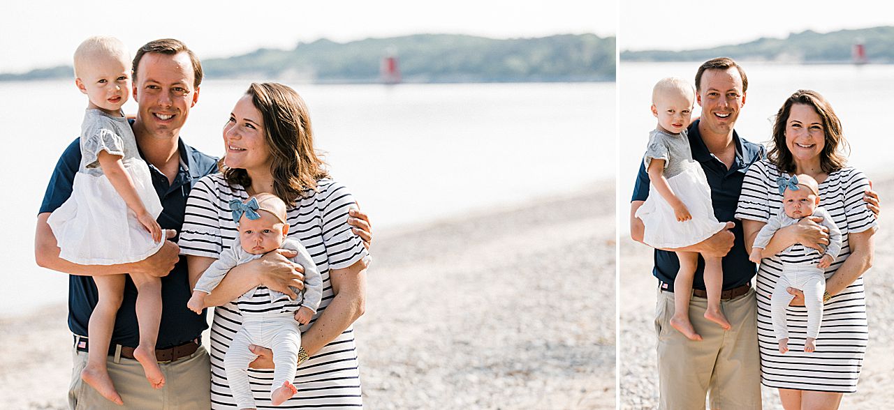 Young family of four on a beach in Charlevoix, Michigan
