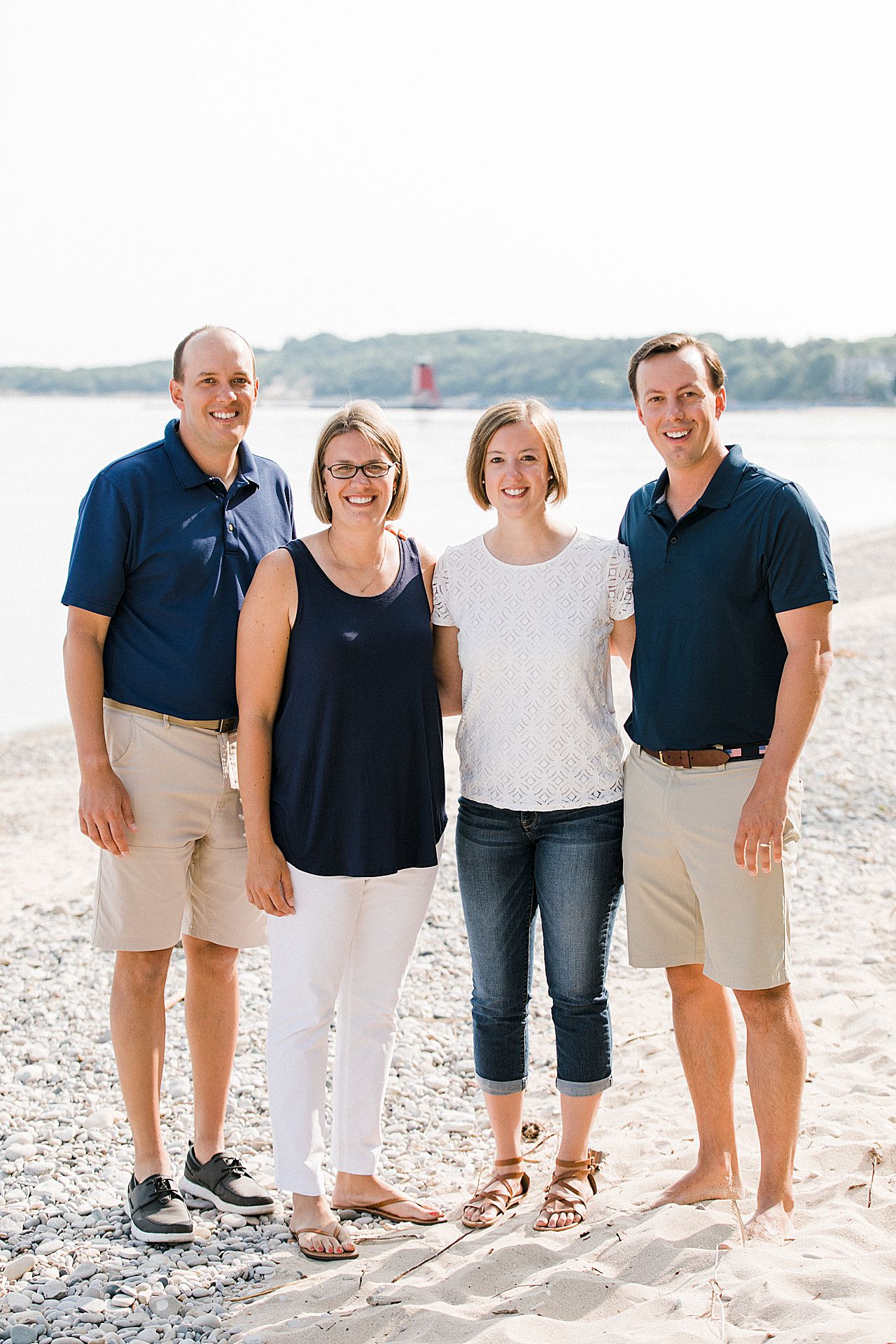 Portrait of four siblings on a beach in Charlevoix, Michigan