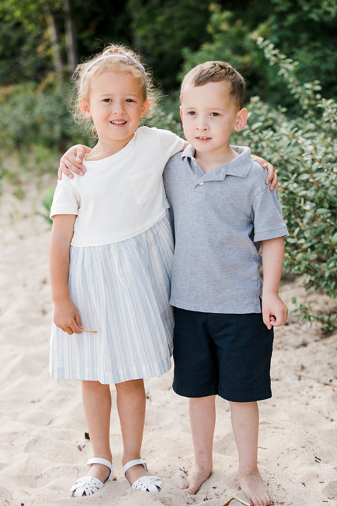 Young brother and sister hugging in Northern Michigan