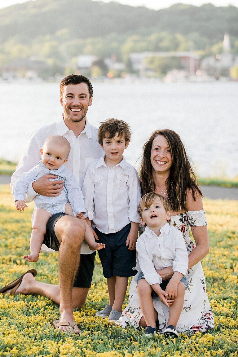 Parents with their three small boys at sunset