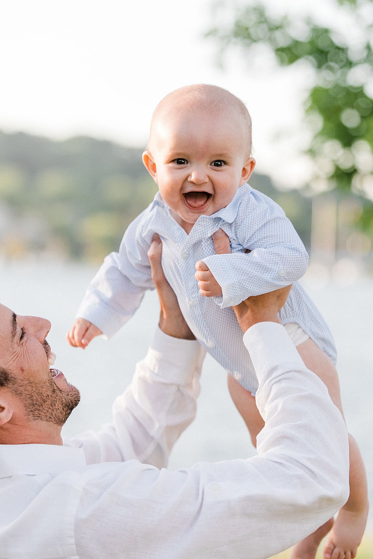 Father lifting his young son in the air
